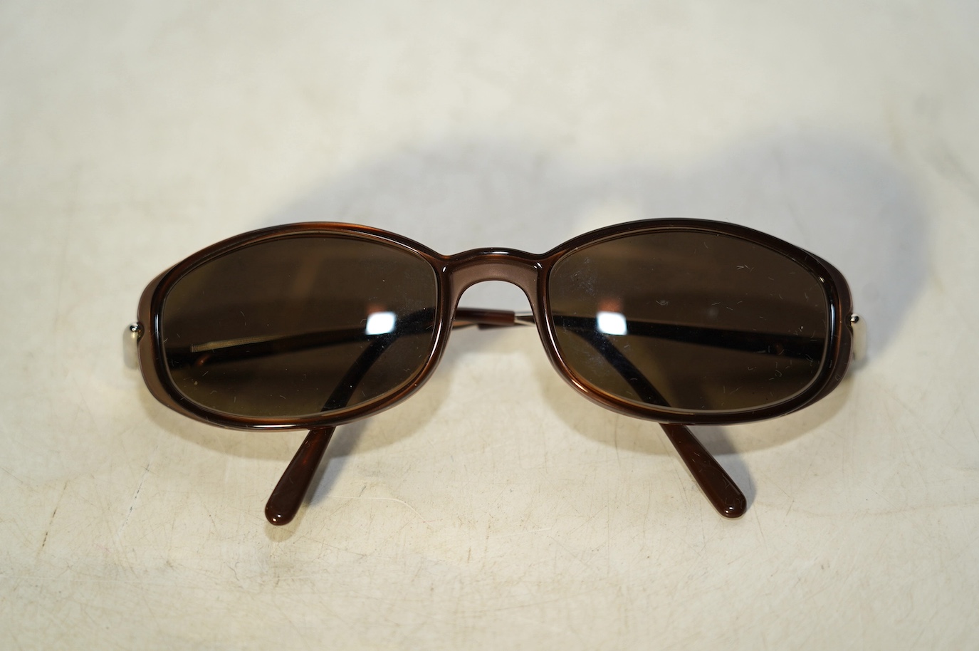 Two pairs of Must de Cartier sunglasses